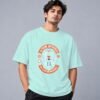 Eat Sleep Ride Motocross 240 GSM Oversized Tee in mint, front view – Kool Kameez