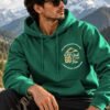 mountain-hoodie-bottle-green-lifestyle-1 The Mountain Is Calling Pullover Hoodie — 300 GSM