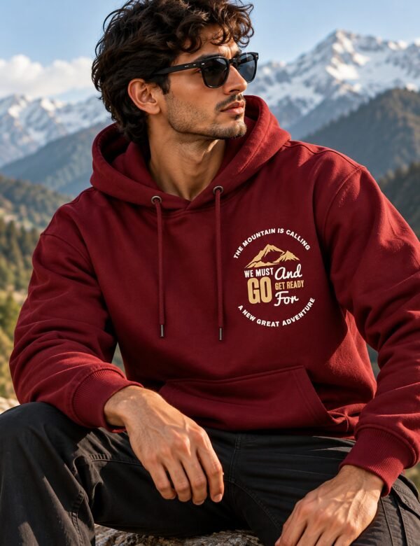 Mountain Is Calling Hoodie — Maroon — worn on a mountain trail The Mountain Is Calling hoodie in Maroon — worn on a mountain trail