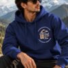 Mountain Is Calling Hoodie — Navy Blue — worn on a mountain trail The Mountain Is Calling hoodie in Navy Blue — worn on a mountain trail