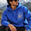 Mountain Is Calling Hoodie — Royal Blue — worn on a mountain trail The Mountain Is Calling hoodie in Royal Blue — worn on a mountain trail