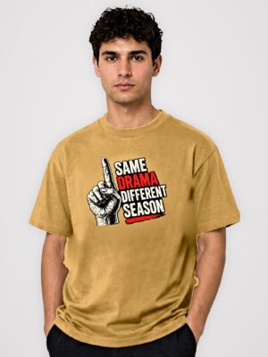 Same Drama Different Season Round Neck T-Shirt Mustard front studio Same Drama Different Season round neck t-shirt in Mustard – front view with the raised-finger chest print