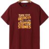 Stepping Stones Quote Round Neck T-Shirt - maroon flat Maroon Turn Your Obstacles Into Stepping Stones quote round neck t-shirt, flat lay view
