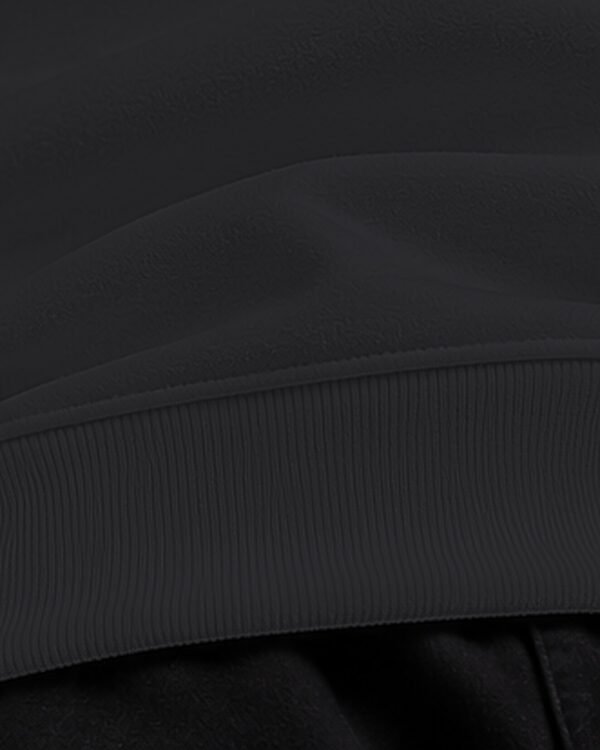 Black heavyweight oversized sweatshirt 400 GSM, ribbed hem close-up Black heavyweight oversized sweatshirt 400 GSM, ribbed hem close-up