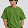 Plain Cotton 220 GSM Oversized Tee – Avocado Green – model front view Plain Cotton 220 GSM Oversized Tee – Avocado Green – model front view