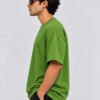 Plain Cotton 220 GSM Oversized Tee – Avocado Green – model left side view Plain Cotton 220 GSM Oversized Tee – Avocado Green – model left side view