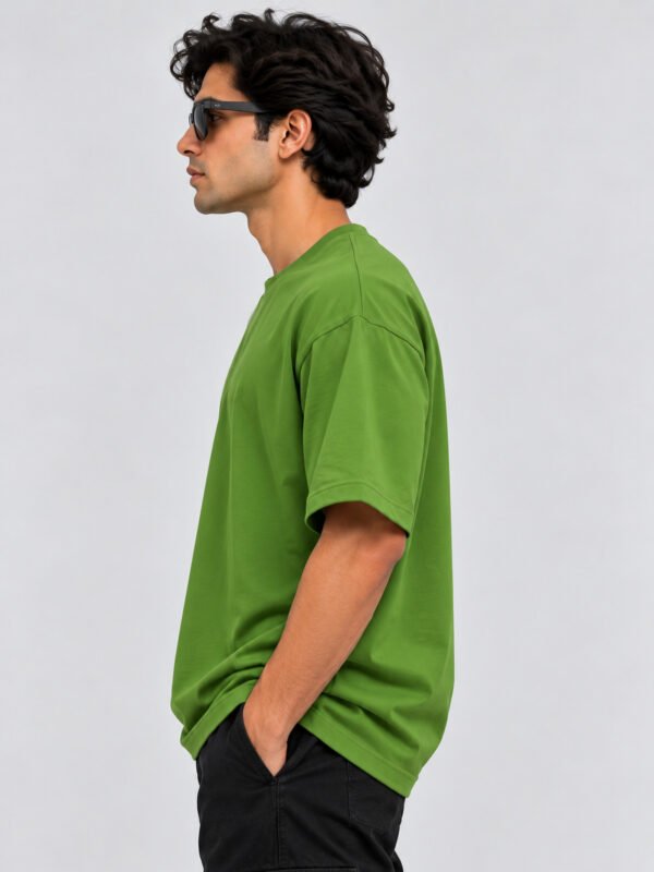 Plain Cotton 220 GSM Oversized Tee – Avocado Green – model left side view Plain Cotton 220 GSM Oversized Tee – Avocado Green – model left side view