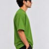 Plain Cotton 220 GSM Oversized Tee – Avocado Green – model right side view Plain Cotton 220 GSM Oversized Tee – Avocado Green – model right side view