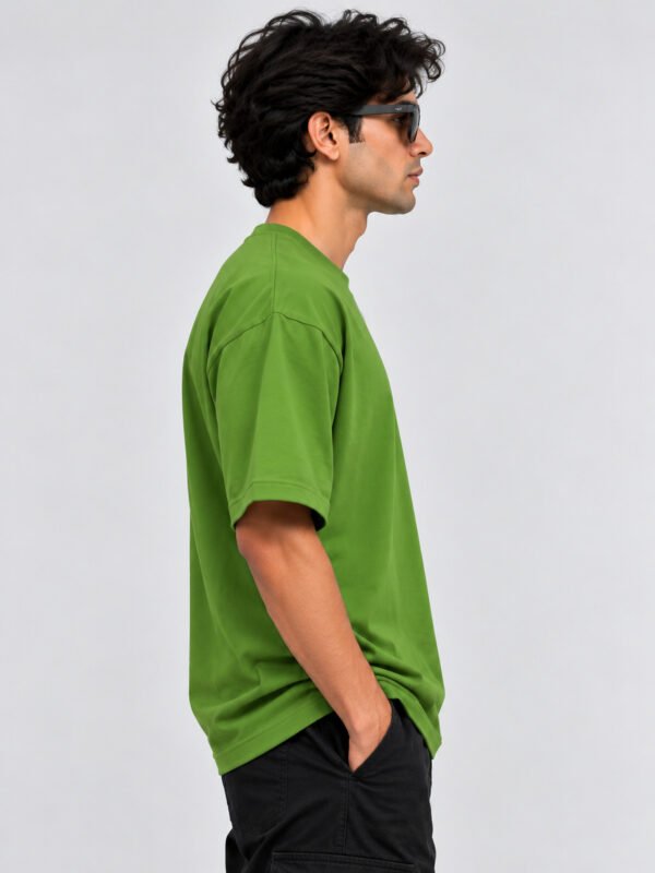 Plain Cotton 220 GSM Oversized Tee – Avocado Green – model right side view Plain Cotton 220 GSM Oversized Tee – Avocado Green – model right side view