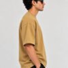 Plain Cotton 220 GSM Oversized Tee – Beige – model right side view Plain Cotton 220 GSM Oversized Tee – Beige – model right side view