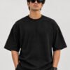 Plain Cotton 220 GSM Oversized Tee – Black – model front view Plain Cotton 220 GSM Oversized Tee – Black – model front view