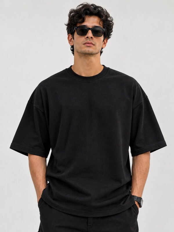 Plain Cotton 220 GSM Oversized Tee – Black – model front view Plain Cotton 220 GSM Oversized Tee – Black – model front view