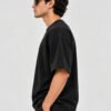 Plain Cotton 220 GSM Oversized Tee – Black – model left side view Plain Cotton 220 GSM Oversized Tee – Black – model left side view