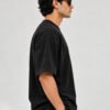 Plain Cotton 220 GSM Oversized Tee – Black – model right side view Plain Cotton 220 GSM Oversized Tee – Black – model right side view