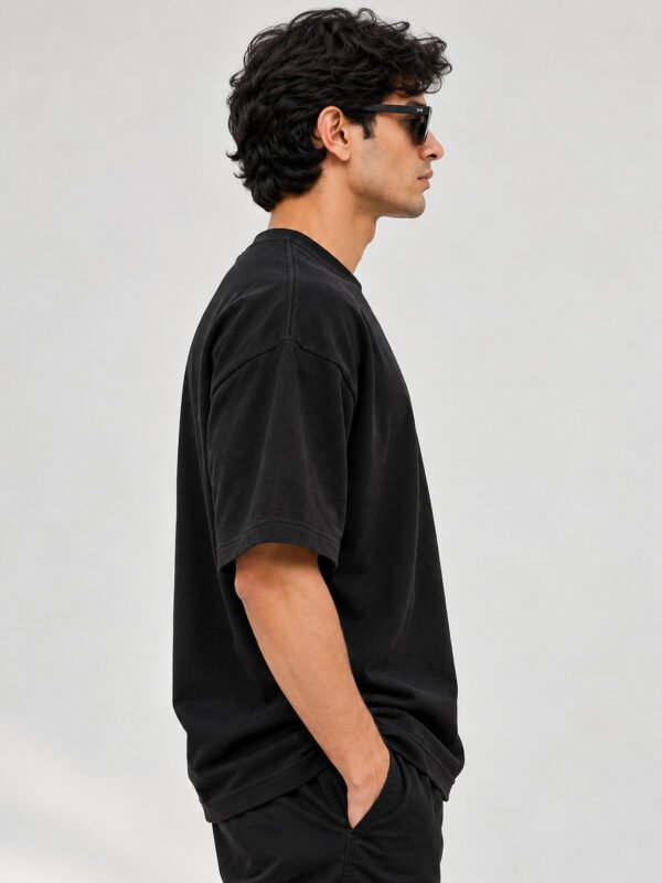 Cotton Terry 240 GSM Oversized Tee – Black – model right side view Cotton Terry 240 GSM Oversized Tee – Black – model right side view