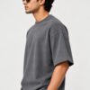 Cotton Terry 240 GSM Oversized Tee – Smokey Grey – model three-quarter view Cotton Terry 240 GSM Oversized Tee – Smokey Grey – model three-quarter view