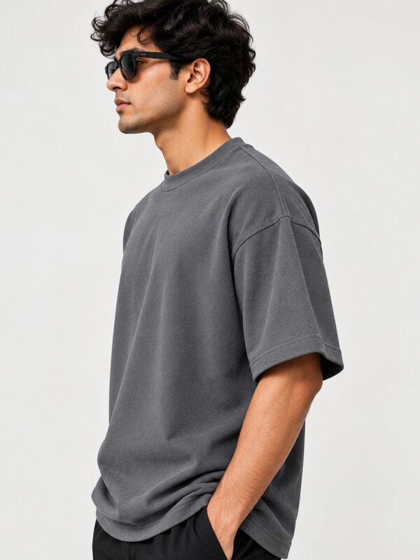 Cotton Terry 240 GSM Oversized Tee – Smokey Grey – model three-quarter view Cotton Terry 240 GSM Oversized Tee – Smokey Grey – model three-quarter view